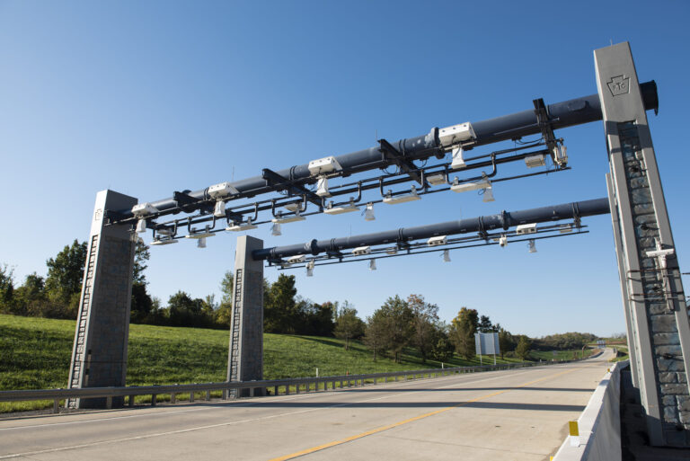 Open-road tolling gantry with ETC RFID antennas and cameras over highway lanes