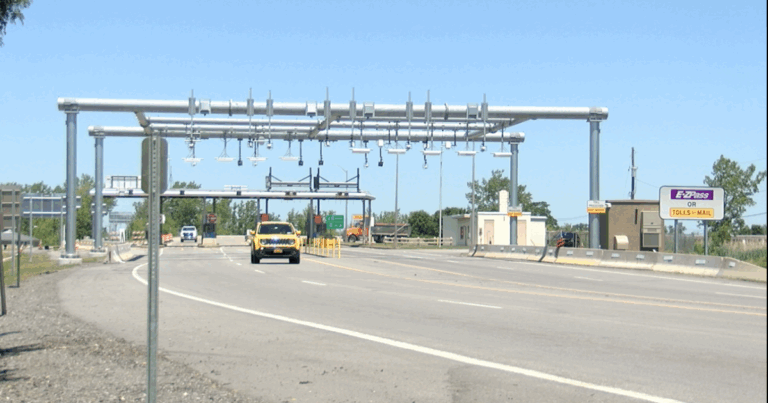 ETC tolling gantry with overhead RFID readers and cameras at an E-ZPass toll point
